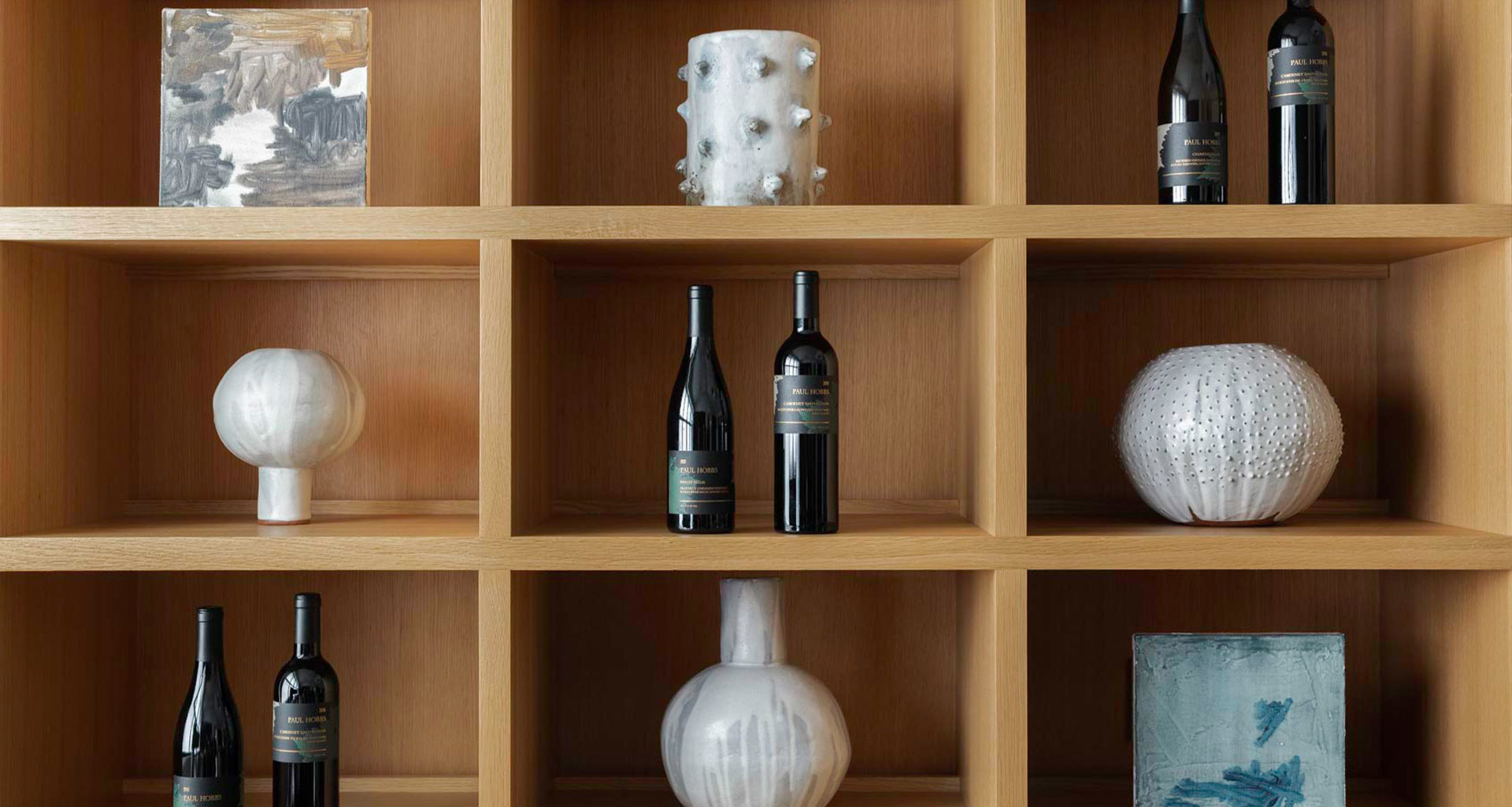 Shelf with paul hobbs wines and vases