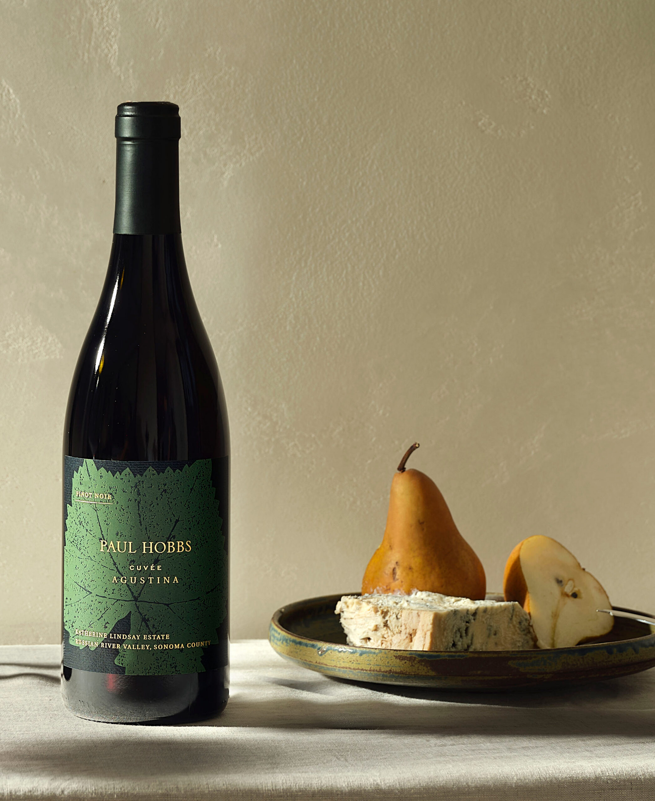 Shelf with paul hobbs wines and vases